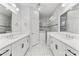 Spacious bathroom with dual sinks, large shower, and elegant tile at 1269 Backspin Dr, Englewood, FL 34223