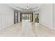 Main bedroom with tile floors, ceiling fan, and access to a patio at 1269 Backspin Dr, Englewood, FL 34223