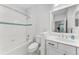 Bathroom with shower/tub combo, toilet and vanity at 1269 Backspin Dr, Englewood, FL 34223