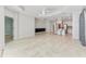 Open living room with tile floors and views into the kitchen at 1269 Backspin Dr, Englewood, FL 34223