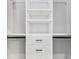 Walk-in closet with custom shelving and drawers at 1269 Backspin Dr, Englewood, FL 34223