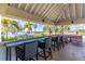 Covered patio overlooking the water and park at 627 Bahia Beach Blvd, Ruskin, FL 33570