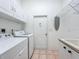 Laundry room with washer, dryer and cabinets at 54 Medalist Pl, Rotonda West, FL 33947