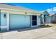 Attached garage with screen door and light fixtures at 54 Medalist Pl, Rotonda West, FL 33947