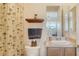 Clean bathroom with shower, vanity, and tropical-themed decor at 6515 Moorings Point Cir # 201, Lakewood Ranch, FL 34202