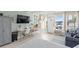 Studio featuring a sofa bed, work area, and access to water views at 611 Destiny Dr # 107, Ruskin, FL 33570