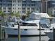 Boats docked at a marina, with a pelican perched on a post at 611 Destiny Dr # 107, Ruskin, FL 33570