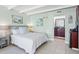 Bright bedroom with a comfortable queen-size bed and en-suite bathroom at 611 Destiny Dr # 107, Ruskin, FL 33570