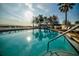 Sparkling community pool with lounge chairs at 611 Destiny Dr # 107, Ruskin, FL 33570