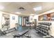 Well-lit weight room with various free weights and machines at 611 Destiny Dr # 107, Ruskin, FL 33570