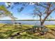 Relaxing waterfront view with picnic tables and grills at 611 Destiny Dr # 107, Ruskin, FL 33570