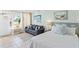 Bright bedroom with a comfortable bed and waterfront view at 611 Destiny Dr # 107, Ruskin, FL 33570