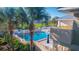 Inviting community pool with surrounding patio furniture at 611 Destiny Dr # 107, Ruskin, FL 33570