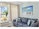 Comfortable living room with a sofa and waterfront views at 611 Destiny Dr # 107, Ruskin, FL 33570