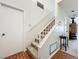 Indoor staircase with carpeted steps and metal railing at 5273 Myrtlewood, Sarasota, FL 34235