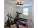 Home gym with stationary bike and treadmill at 15412 Trinity Fall Way, Bradenton, FL 34212