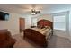 Spacious main bedroom with large bed and ensuite bathroom access at 15412 Trinity Fall Way, Bradenton, FL 34212