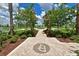 Landscaped community path leading to a central water feature at 15412 Trinity Fall Way, Bradenton, FL 34212