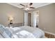 Comfortable bedroom with a queen bed, ceiling fan, and access to en-suite bathroom at 16806 1St E Ave, Bradenton, FL 34212