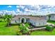 Single-Gathering home with manicured lawn and walkway at 16806 1St E Ave, Bradenton, FL 34212