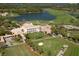 Aerial view of a country club with lush landscaping at 21 Bayhead Ln, Osprey, FL 34229