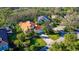 Property showcasing a tile roof, and a lush green lawn at 21 Bayhead Ln, Osprey, FL 34229