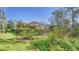 Spacious backyard with screened enclosure and lush landscaping at 21 Bayhead Ln, Osprey, FL 34229