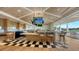 Upscale bar with a modern design and large windows overlooking a golf course at 21 Bayhead Ln, Osprey, FL 34229