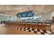 Modern bar with multiple screens and a view at 21 Bayhead Ln, Osprey, FL 34229