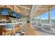 Indoor-outdoor bar with seating and views of a golf course at 21 Bayhead Ln, Osprey, FL 34229