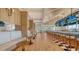 Long bar with teal barstools and large screens at 21 Bayhead Ln, Osprey, FL 34229