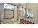 Clean bathroom with a shower/tub combo and granite countertops at 21 Bayhead Ln, Osprey, FL 34229