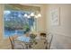Kitchen breakfast nook with glass table and view of the pool at 21 Bayhead Ln, Osprey, FL 34229