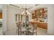 Formal dining area with a glass table and built-in cabinetry at 21 Bayhead Ln, Osprey, FL 34229