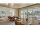 Large dining room with round tables and views of the golf course at 21 Bayhead Ln, Osprey, FL 34229