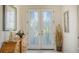 Elegant entry with double doors and a decorative mirror at 21 Bayhead Ln, Osprey, FL 34229