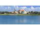 Clubhouse sits on the lake with palm trees at 21 Bayhead Ln, Osprey, FL 34229