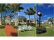 Landscaped grounds with gazebo, chairs, and clock at 21 Bayhead Ln, Osprey, FL 34229