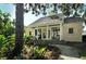 Small guest house with porch and surrounding garden at 21 Bayhead Ln, Osprey, FL 34229