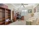 Bright home office with built-in shelving and comfortable seating at 21 Bayhead Ln, Osprey, FL 34229