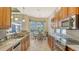 Eat-in kitchen with stainless steel appliances and granite countertops at 21 Bayhead Ln, Osprey, FL 34229