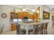 Kitchen with breakfast bar, granite countertops, and wood cabinets at 21 Bayhead Ln, Osprey, FL 34229