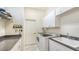 Bright laundry room with washer, dryer, and ample storage space at 21 Bayhead Ln, Osprey, FL 34229