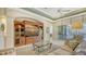 Living room with built-in entertainment center and access to pool area at 21 Bayhead Ln, Osprey, FL 34229