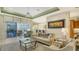 Spacious living room with a view of the pool and lanai at 21 Bayhead Ln, Osprey, FL 34229