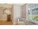 Relaxing lounge area with comfortable seating and natural light at 21 Bayhead Ln, Osprey, FL 34229