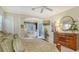Main bedroom with large dresser, king-size bed, and window seat at 21 Bayhead Ln, Osprey, FL 34229