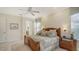 Main bedroom with king-size bed and access to the bathroom at 21 Bayhead Ln, Osprey, FL 34229