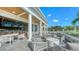 Outdoor patio area with seating and views of the golf course at 21 Bayhead Ln, Osprey, FL 34229
