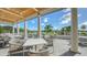 Outdoor patio with comfortable seating and beautiful golf course views at 21 Bayhead Ln, Osprey, FL 34229